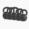 Set of black kettlebells with weight markings on a white background