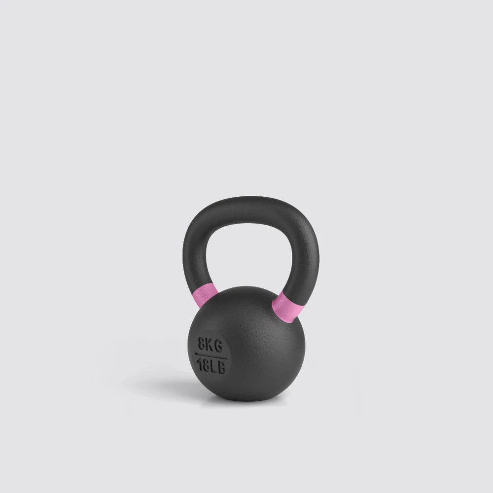 Black kettlebell with pink accents on a light gray background