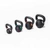 Set of black kettlebells with colored handles on a white background