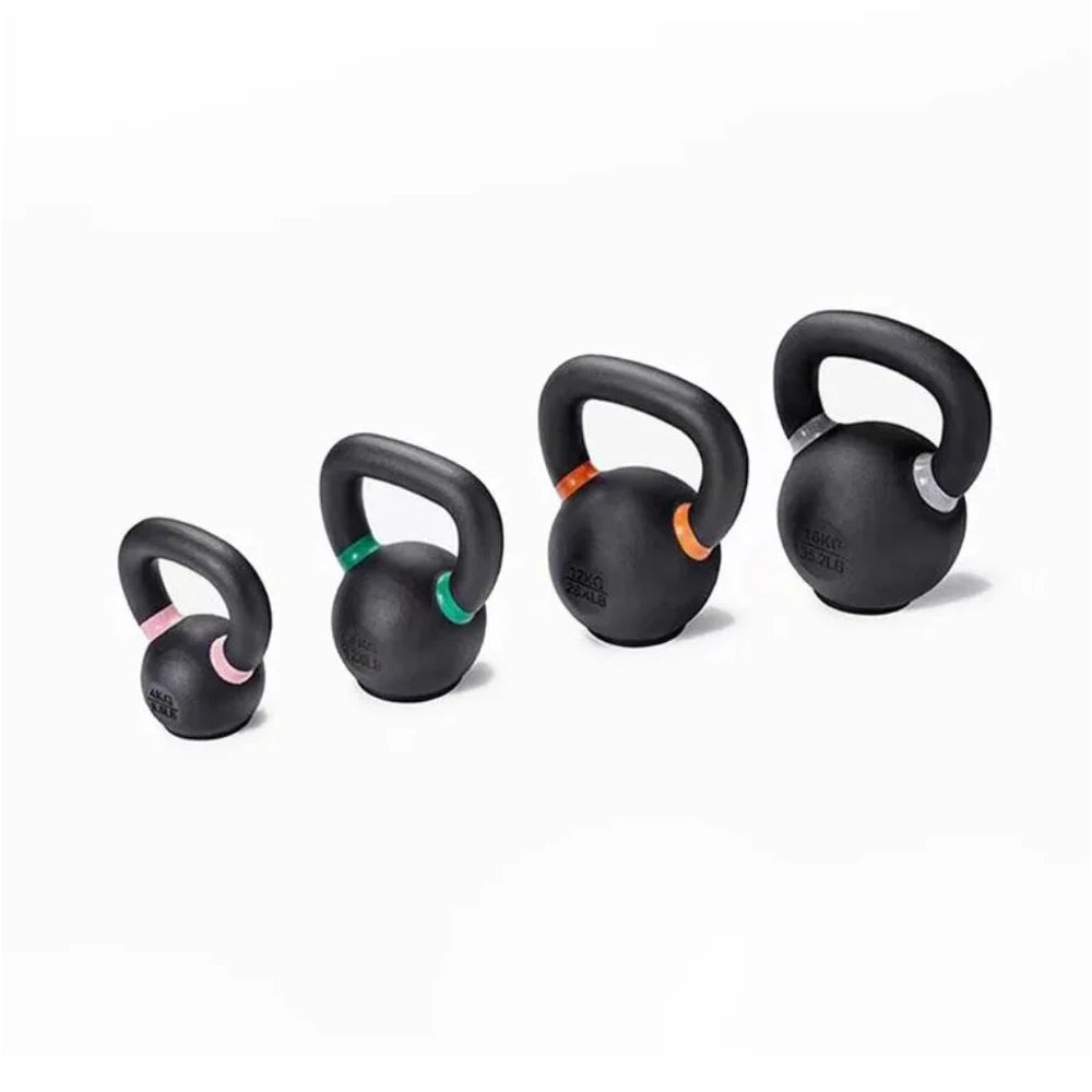 Set of black kettlebells with colored handles on a white background