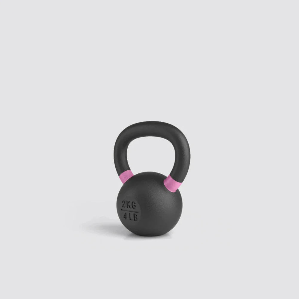 Black kettlebell with pink accents on a light gray background
