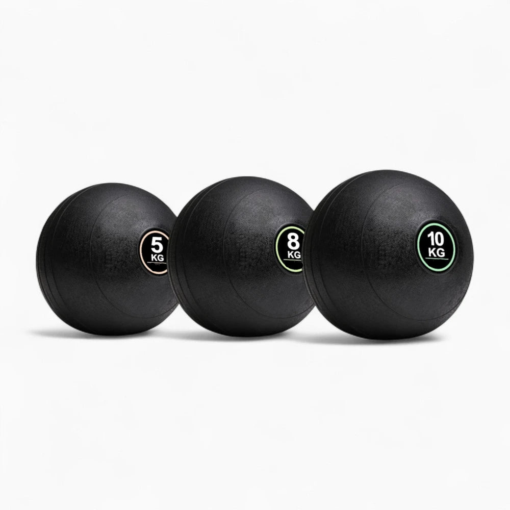 Three black exercise balls with weight labels on a white background