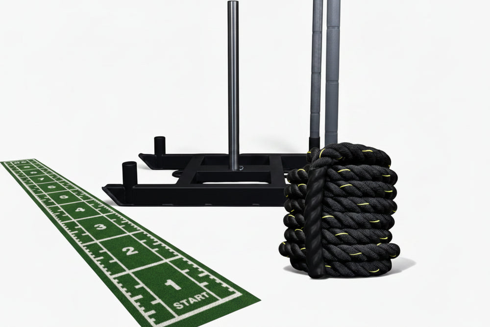 Resistance training set with battle ropes, power sled and sled mat on a white background