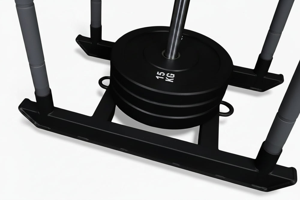Black power sled with weight plates on a white background