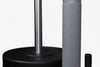 Close-up of weight plates loaded onto a power sled with textured anti slip grips on a white background
