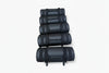 Stack of black gym bags on a white background
