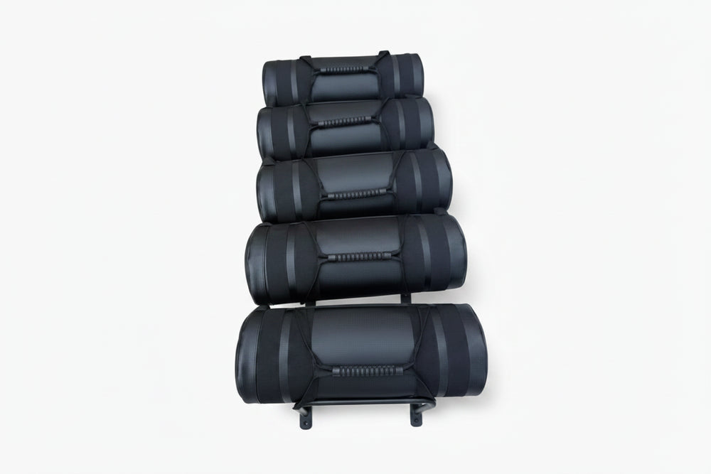 Stack of black gym bags on a white background