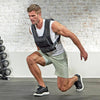 Man exercising with a weight vest in a gym setting