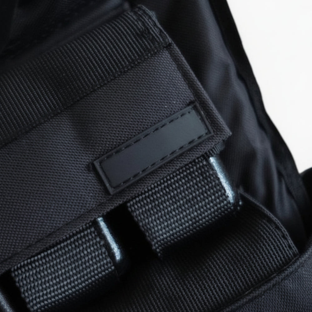 Black weighted vest on a white background
