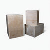 Three wooden jump boxes of different sizes stacked on a white background