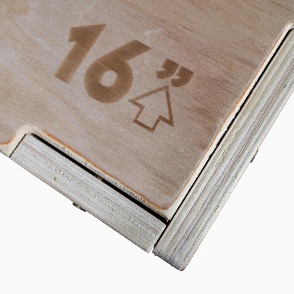 Wooden jump box with '16"' and arrow symbol on a white background