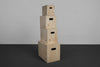 Stack of wooden jump boxes with visible numbers on a gray background