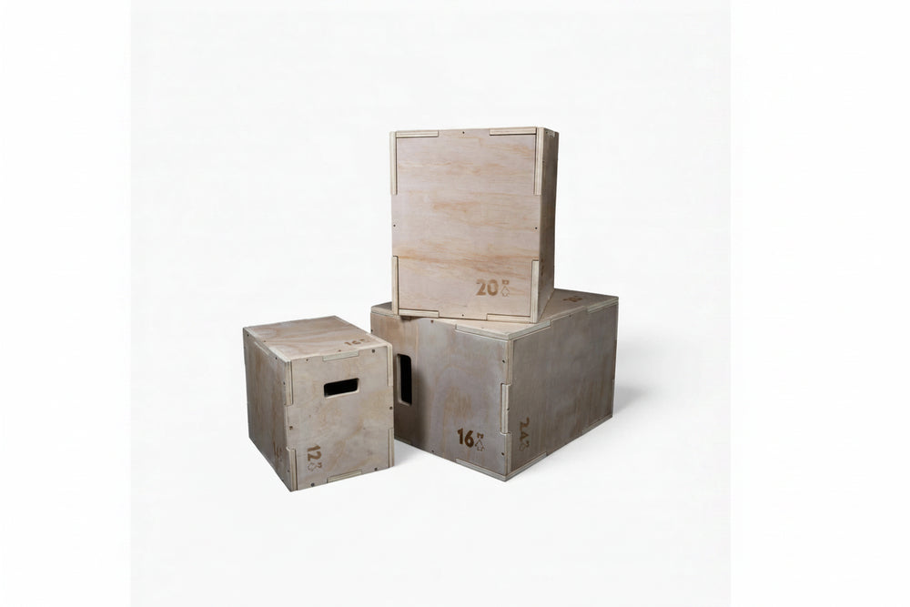 Three wooden jump boxes with different sizes stacked on a white background