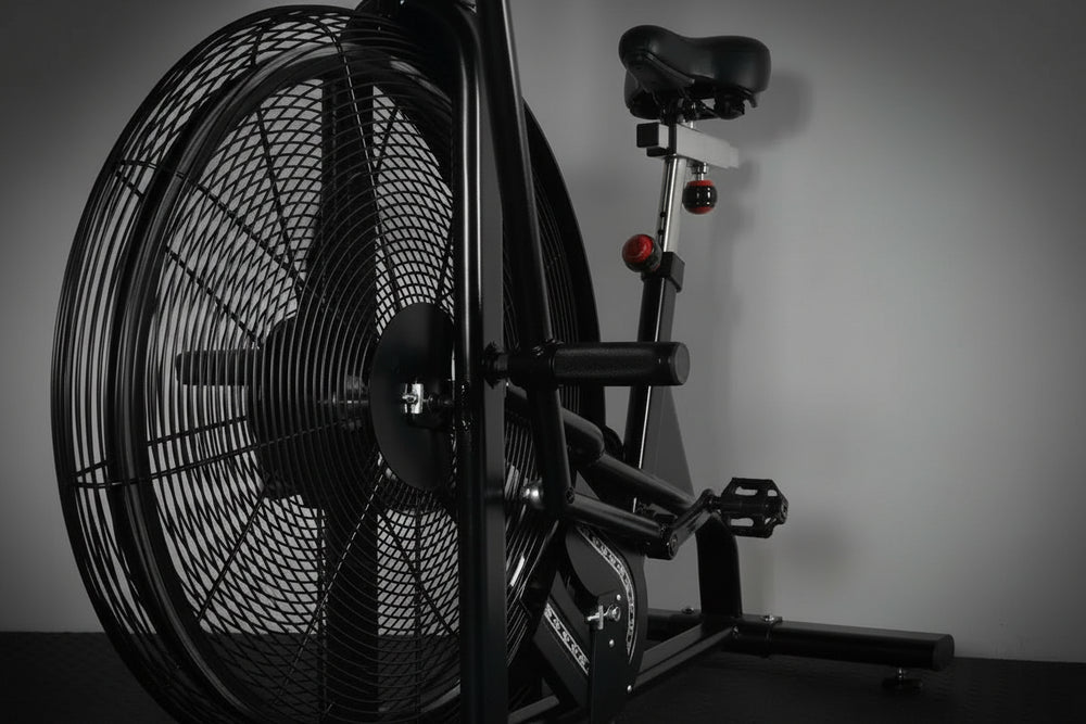 Close-up of assault air bike with a focus on the fan and seat.