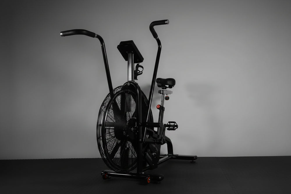 Exercise air bike on a dark background