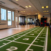 Indoor sports facility with a commercial power sledge mat