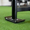 Black metal power sled on textured power sled mat