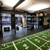 Gym interior with power sled flooring mat in a commercial gym setting