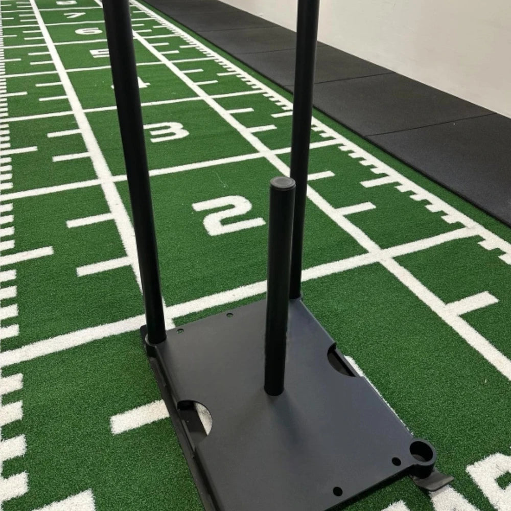 Power sled on sled mat with white line markings