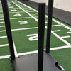 Power sled on a sledge training mat with clear white markings