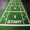 Green sledge mat with white markings and start position.