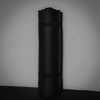 Black rolled-up gym mat on a gray background