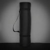 Black gym mat on a gray background