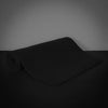 Black gym mat on a dark background