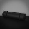 Black exercise mat rolled up on a dark background