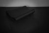 Black gym mat on a dark background