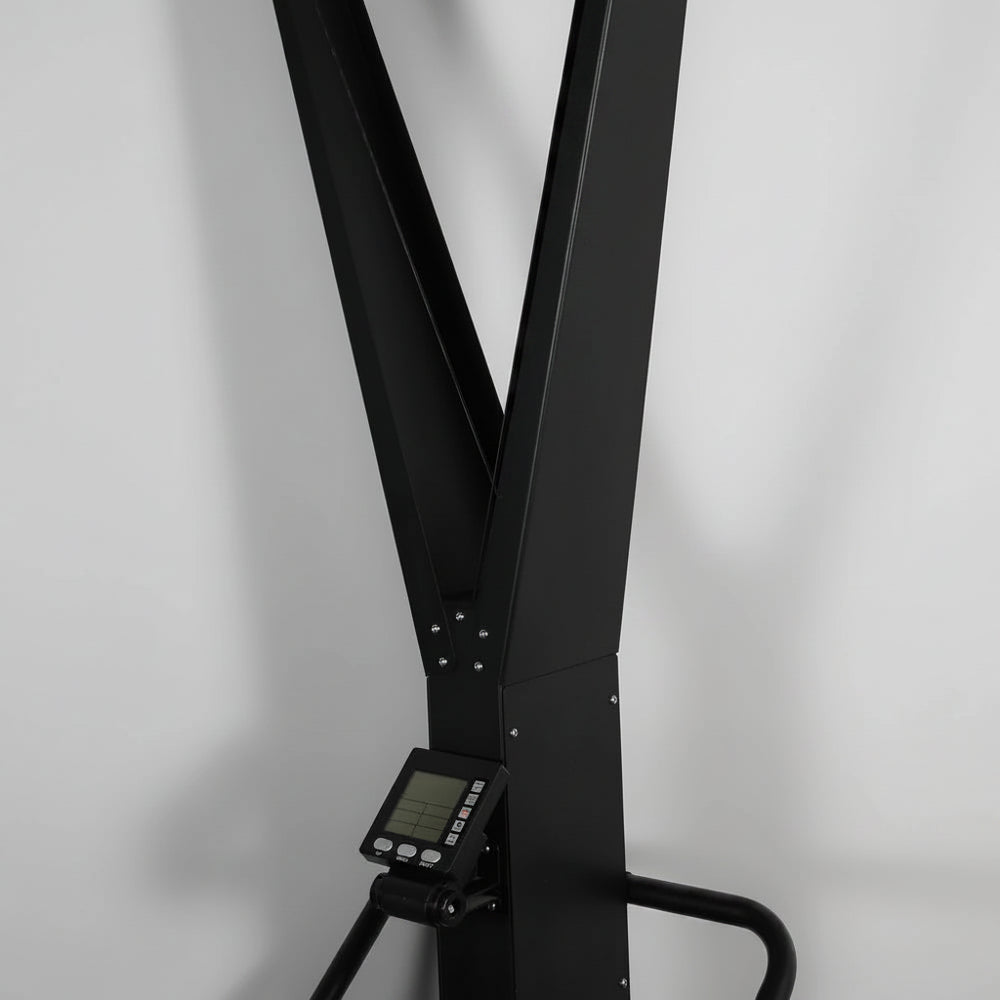 Black exercise ski erg machine on a gray background