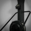 Black exercise ski erg with digital display on a gray background