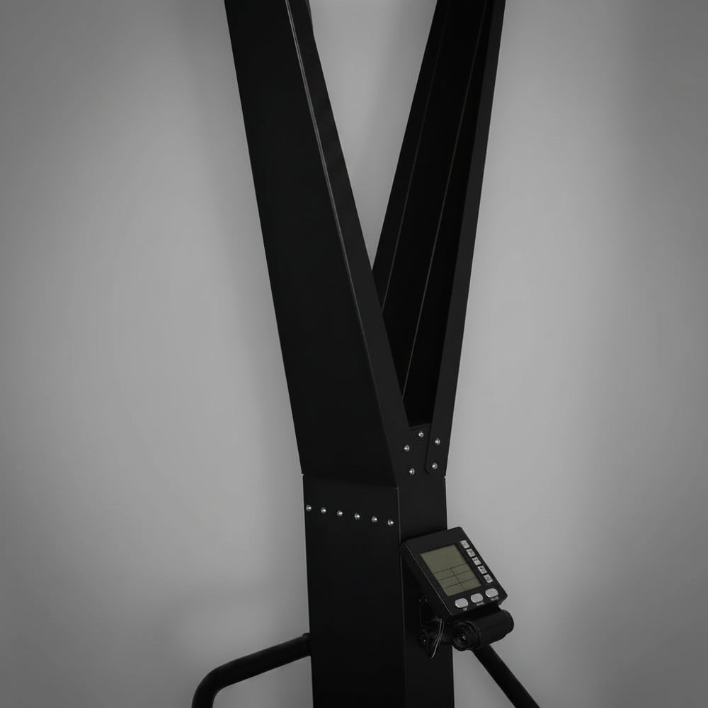 Black exercise ski erg on a gray background
