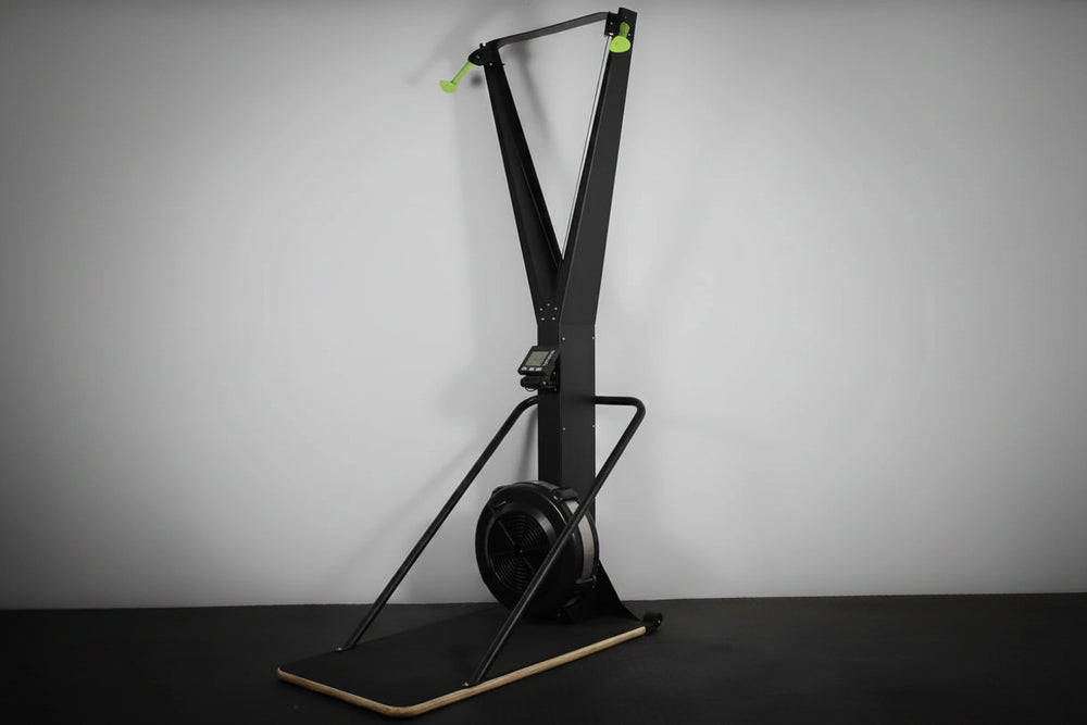 Black ski erg exercise machine on a gray background