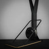 Black exercise ski erg with digital display on a gray background