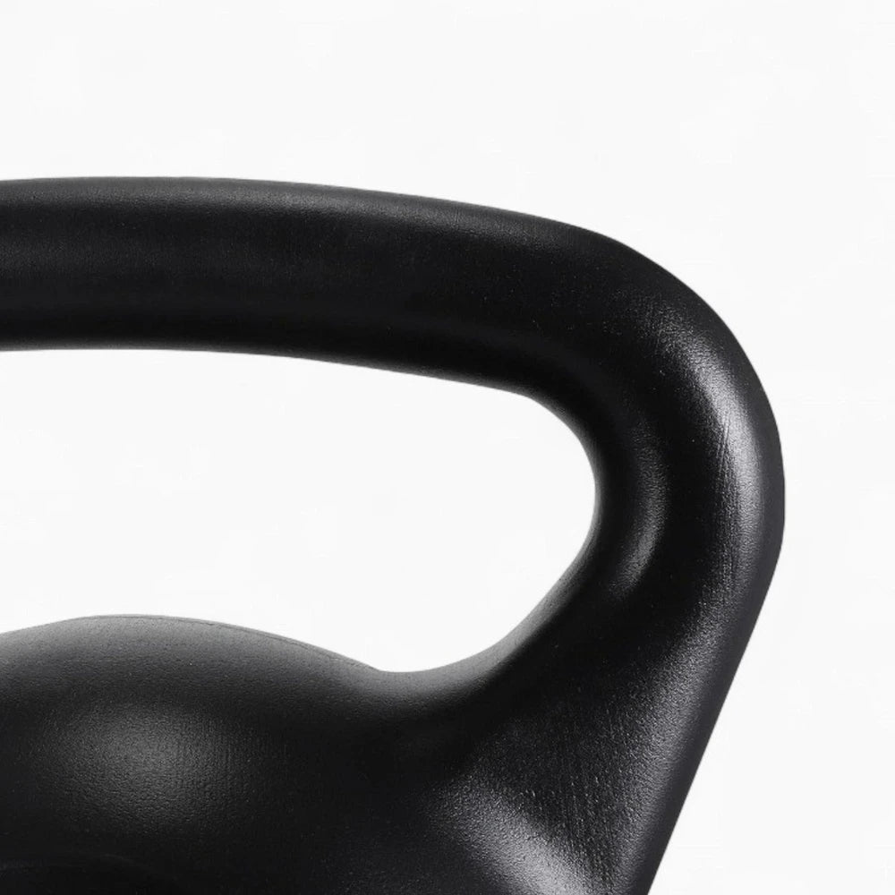 Close-up of a black kettlebell handle on a white background