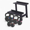 Set of black kettlebells with a weight bench on a white background