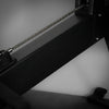 Black frame of a row erg machine on a dark background