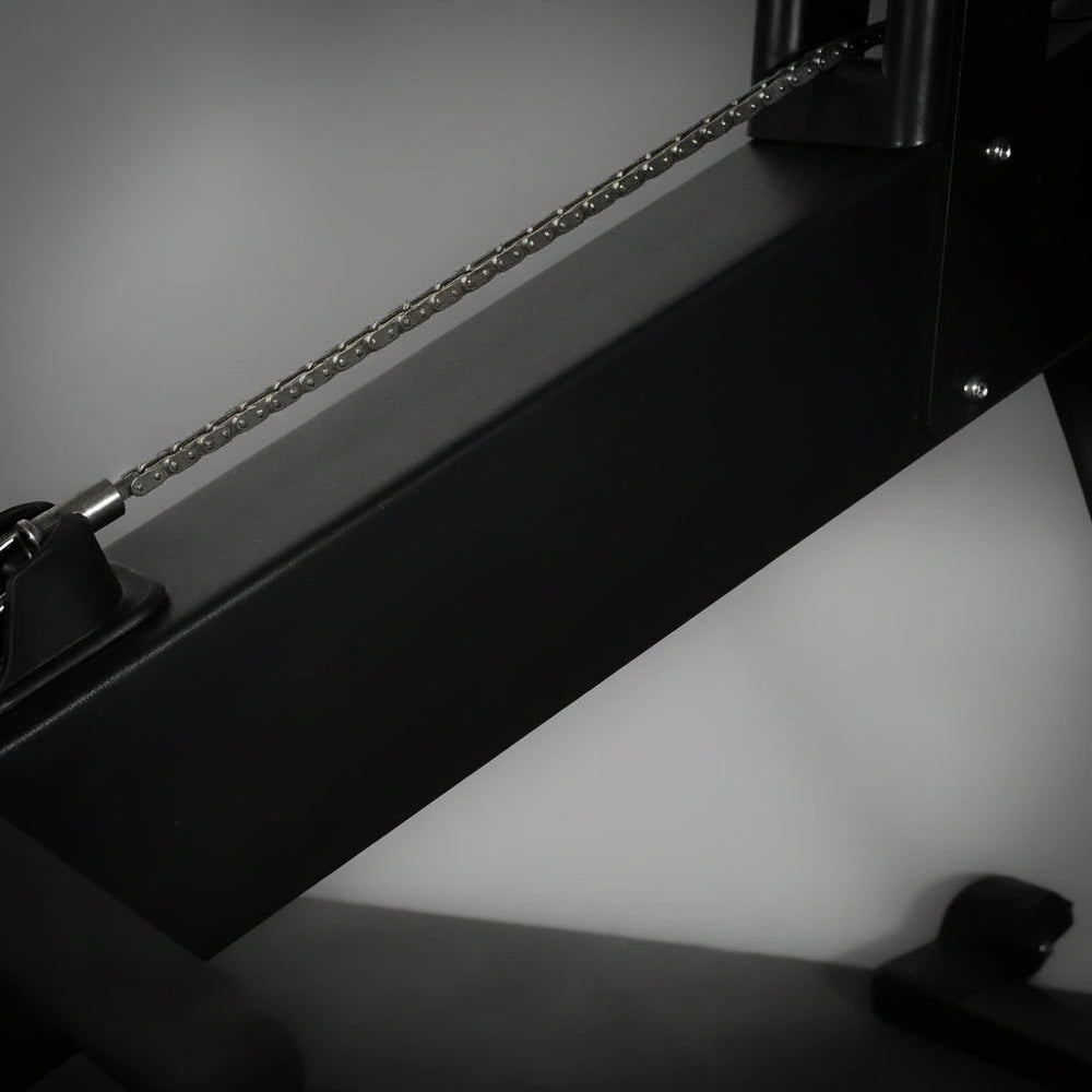 Black frame of a row erg machine on a dark background