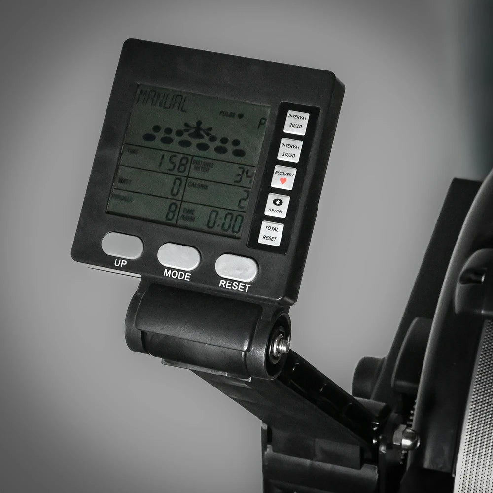 Close-up of a digital display on a piece of exercise equipment with a gray background
