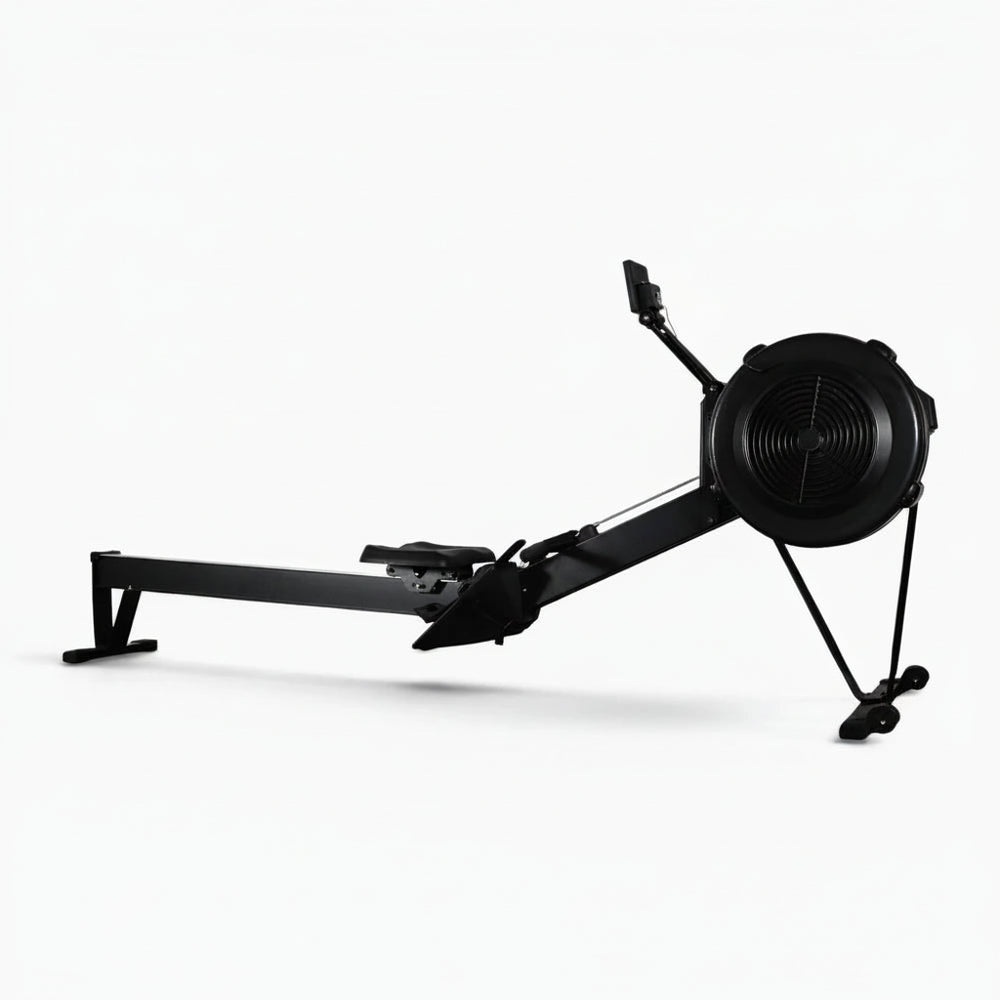 Black rowing erg machine on a white background