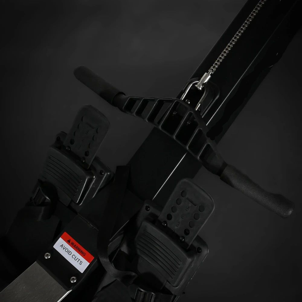 Close-up of a black exercise device on a dark background