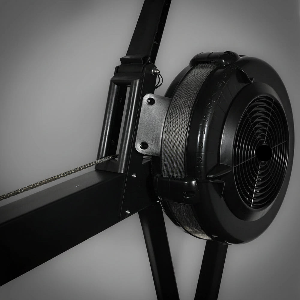 Close-up of a black row erg machine on a dark background
