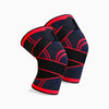 Pair of black and red knee sleeves on a white background
