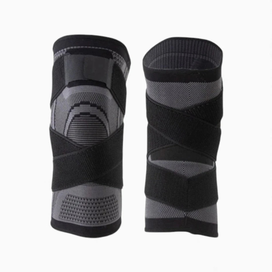Black and gray knee brace on a white background