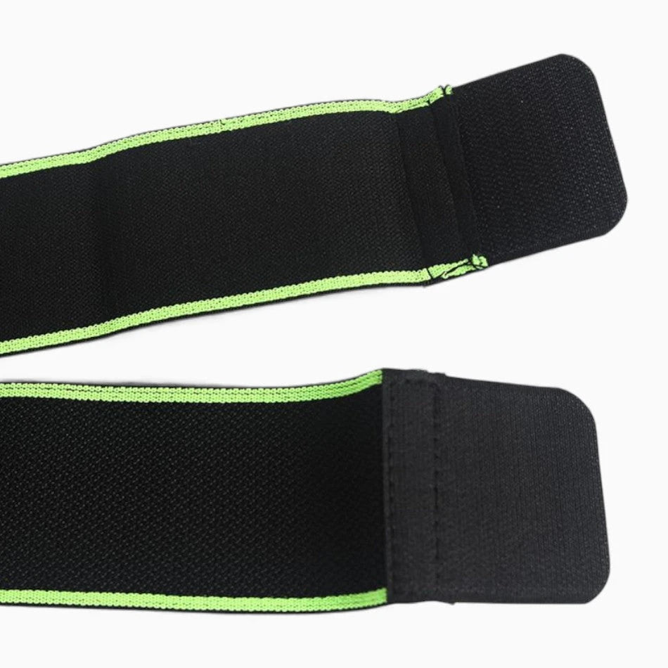 Black knee brace straps with green trim on a white background