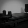 Black pilates reformer on a grey background