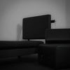 Black pilates exercise machine on a gray background