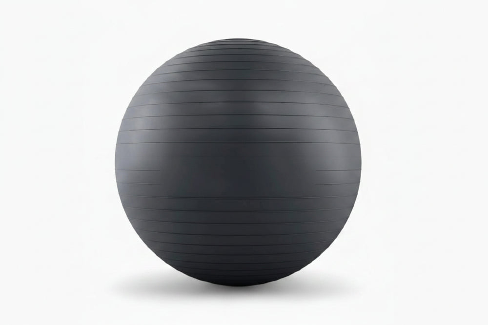 Black exercise ball on a white background