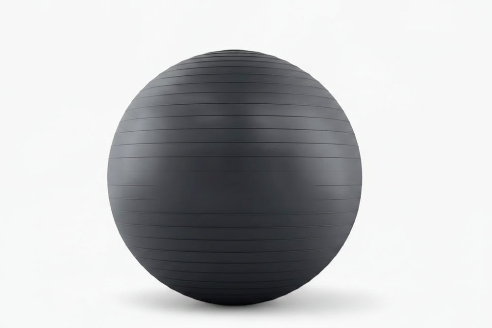 Black exercise ball on a white background
